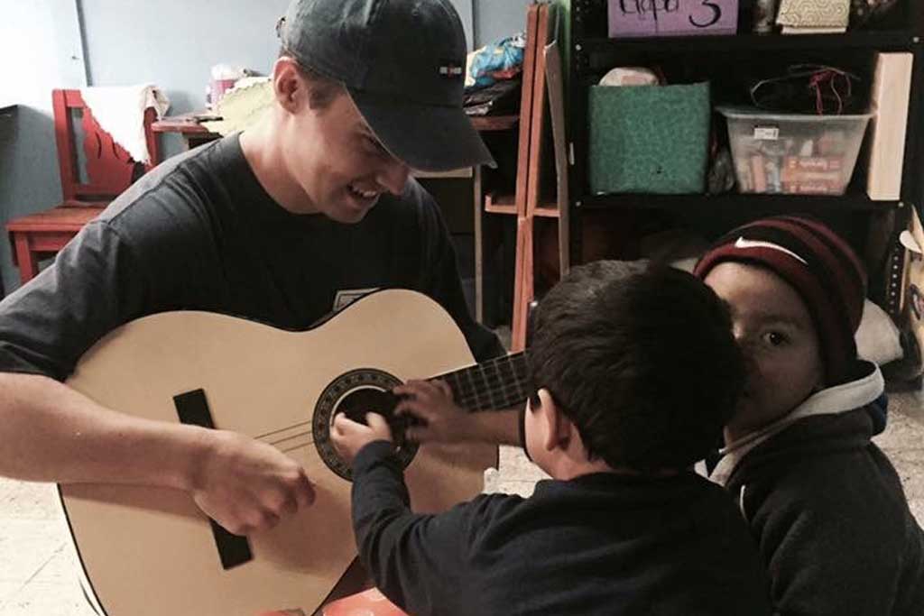 George Playing Music for the Children